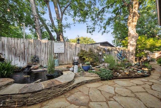 9705 Ash Creek Dr, Dallas, TX 75228 - fenced backyard with a patio