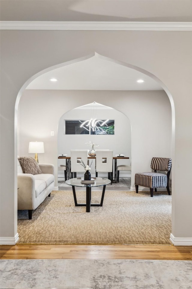 9705 Ash Creek Dr, Dallas, TX 75228 - living room featuring arched walkways, wood finished floors, ornamental molding, recessed lighting, and baseboards