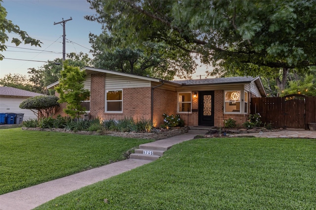 9705 Ash Creek Dr, Dallas, TX 75228 - view of front of property featuring brick siding and a gate