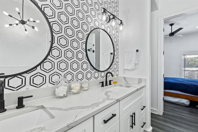 2100 N Fitzhugh Ave Unit D, Dallas, TX 75204 - full bath with double vanity, ceiling fan, ensuite bath, and a chandelier