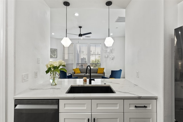2100 N Fitzhugh Ave Unit D, Dallas, TX 75204 - kitchen featuring dishwashing machine, a sink, ceiling fan, white cabinetry, and light stone counters