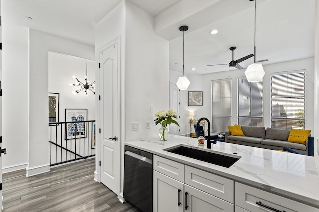 2100 N Fitzhugh Ave Unit D, Dallas, TX 75204 - kitchen featuring stainless steel dishwasher, a sink, light wood-type flooring, ceiling fan, and light stone countertops