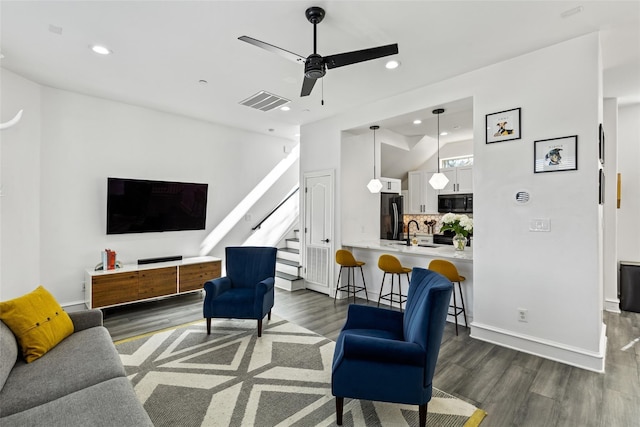 2100 N Fitzhugh Ave Unit D, Dallas, TX 75204 - living area with dark wood finished floors, stairway, a ceiling fan, recessed lighting, and baseboards