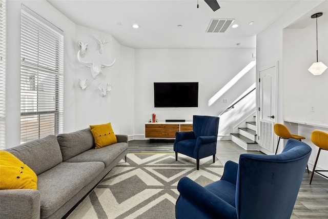 2100 N Fitzhugh Ave Unit D, Dallas, TX 75204 - living room with wood finished floors, stairs, ceiling fan, and recessed lighting