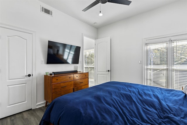 2100 N Fitzhugh Ave Unit D, Dallas, TX 75204 - bedroom featuring multiple windows, dark wood finished floors, ceiling fan, and baseboards