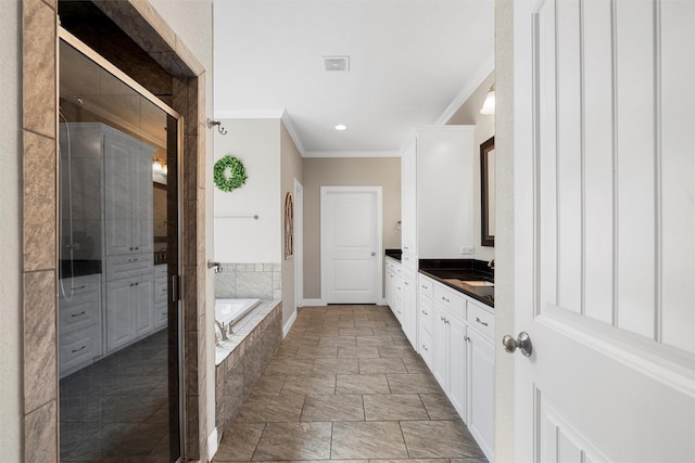 41 N Shore Cir, Waco, TX 76708 - bathroom featuring ornamental molding, vanity, a bath, a shower stall, and stone finish flooring
