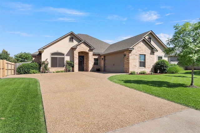 41 N Shore Cir, Waco, TX 76708 - view of front of house with brick siding, concrete driveway, a garage, and a shingled roof