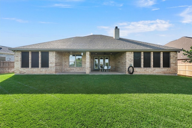 41 N Shore Cir, Waco, TX 76708 - back of property with brick siding, a patio area, a chimney, and a shingled roof