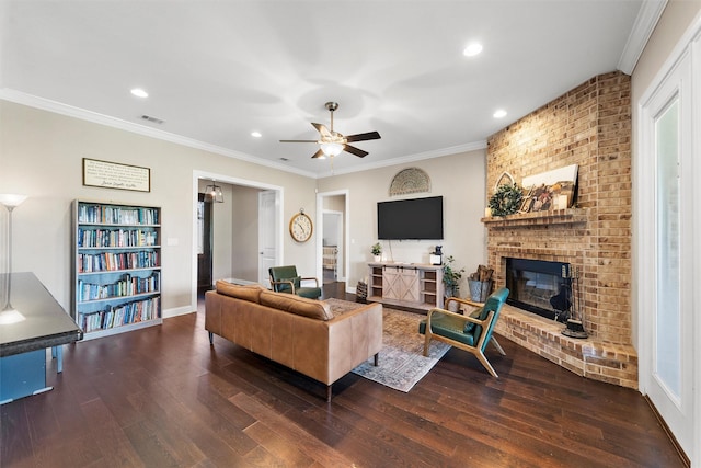 41 N Shore Cir, Waco, TX 76708 - living room featuring a brick fireplace, wood finished floors, ceiling fan, recessed lighting, and crown molding