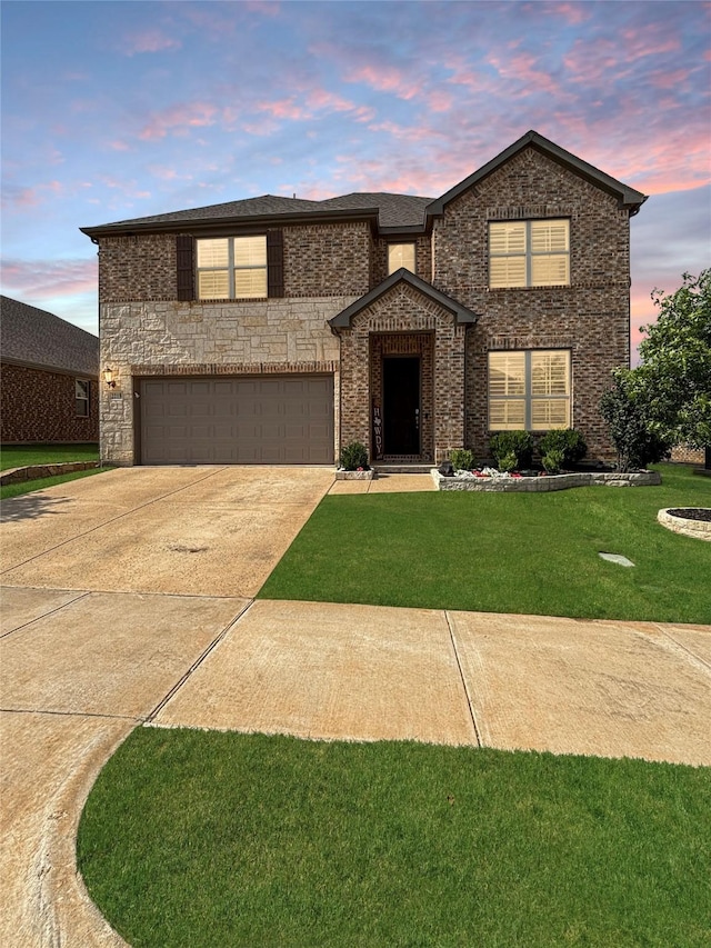 2219 Wellington Ln, Corinth, TX 76210 - traditional-style house with concrete driveway, a garage, a front yard, and brick siding