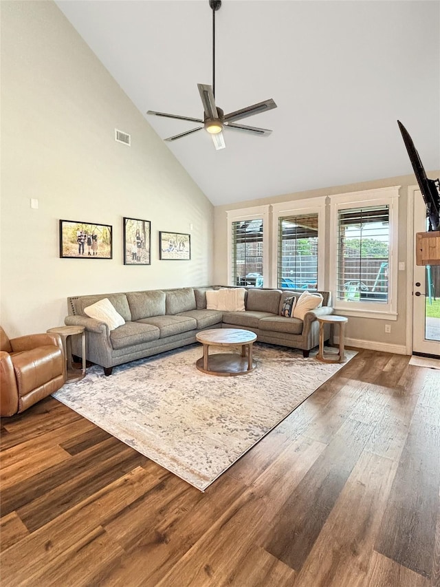 2219 Wellington Ln, Corinth, TX 76210 - living room with high vaulted ceiling, wood finished floors, a ceiling fan, and baseboards
