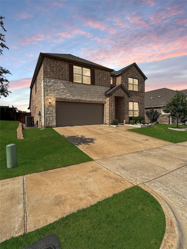 2219 Wellington Ln, Corinth, TX 76210 - traditional home featuring concrete driveway, an attached garage, central AC unit, and stone siding