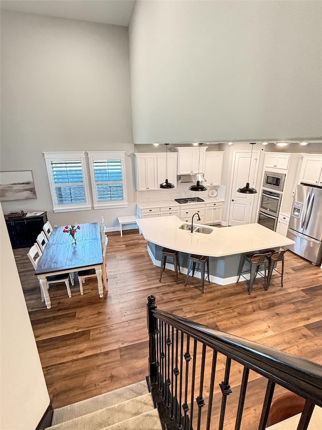 2219 Wellington Ln, Corinth, TX 76210 - living room featuring a high ceiling and wood finished floors
