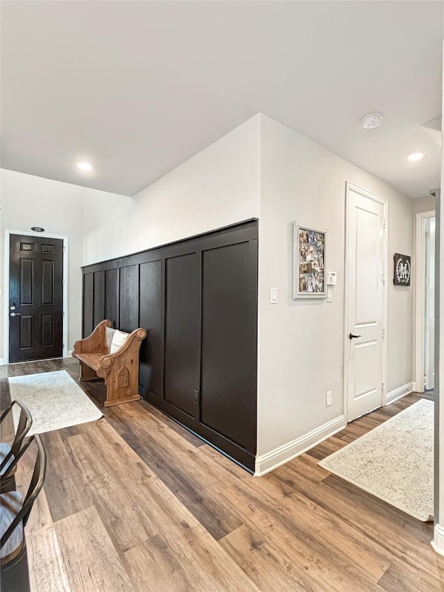 2219 Wellington Ln, Corinth, TX 76210 - foyer with light wood-style flooring and baseboards