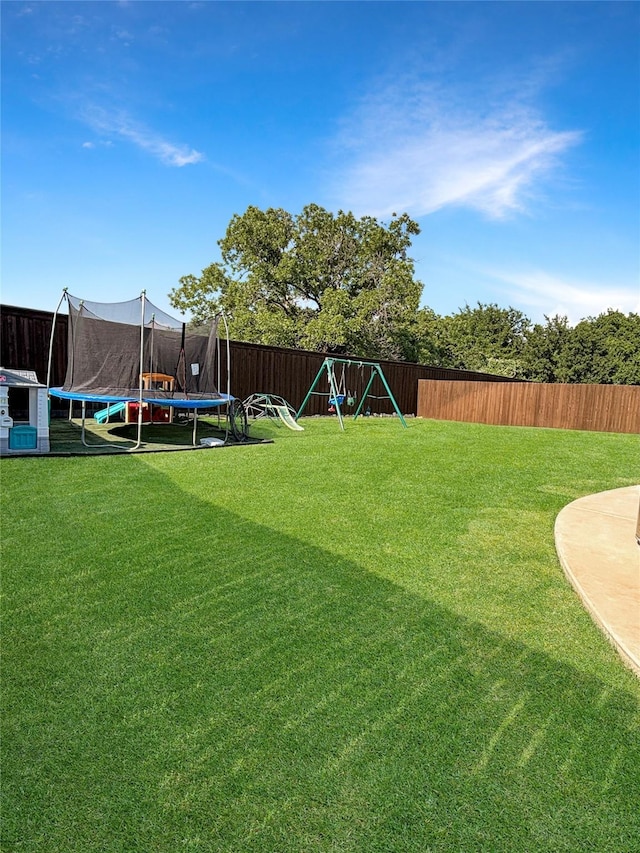 2219 Wellington Ln, Corinth, TX 76210 - view of yard featuring a trampoline