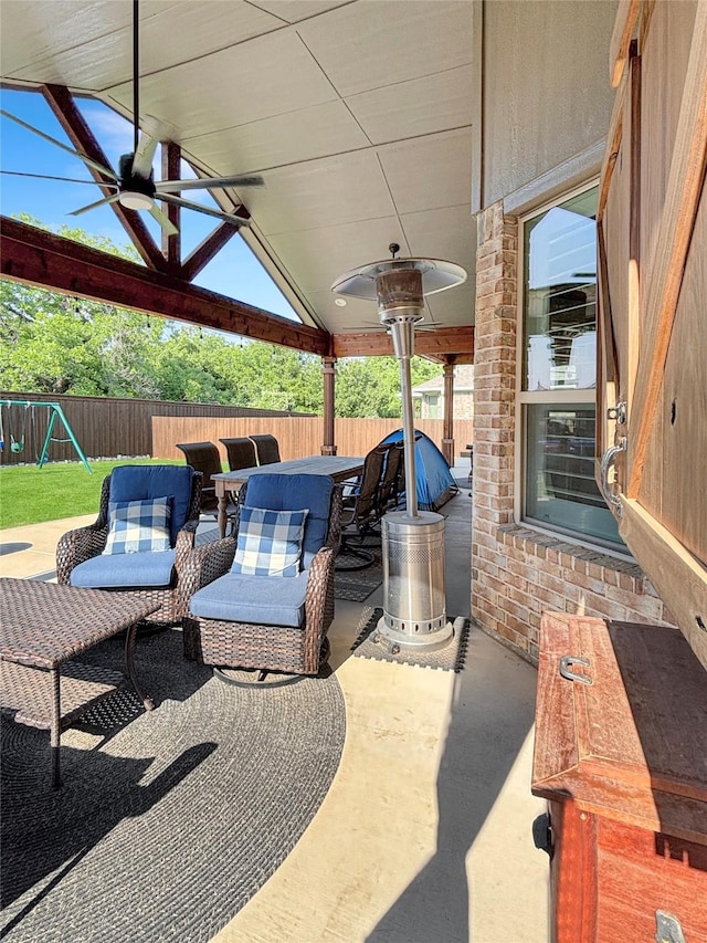 2219 Wellington Ln, Corinth, TX 76210 - fenced backyard with a ceiling fan, a patio area, a playground, and outdoor lounge area