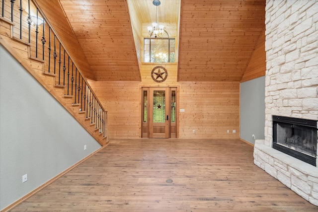 108 Fcr 868, Teague, TX 75860 - foyer with high vaulted ceiling, wood ceiling, a chandelier, stairs, and a stone fireplace