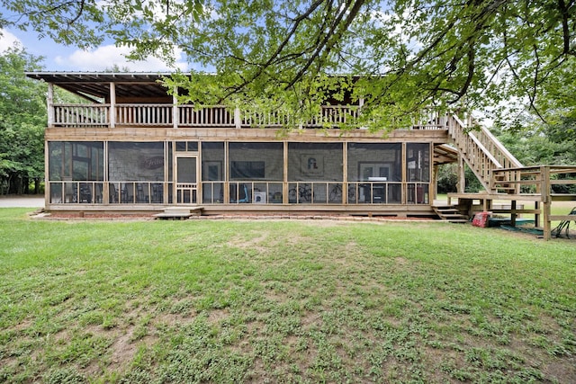 108 Fcr 868, Teague, TX 75860 - rear view of house featuring a sunroom, a yard, and stairs