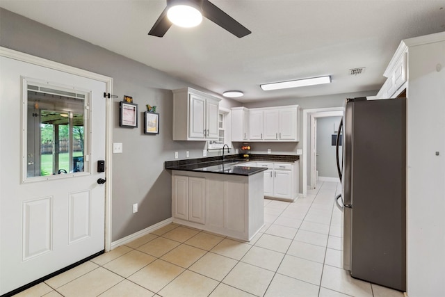 110 Harmon Cir, Blue Ridge, TX 75424 - kitchen featuring freestanding refrigerator, a sink, a peninsula, ceiling fan, and baseboards