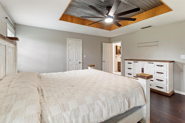 110 Harmon Cir, Blue Ridge, TX 75424 - bedroom with a tray ceiling, dark wood-type flooring, baseboards, and ceiling fan