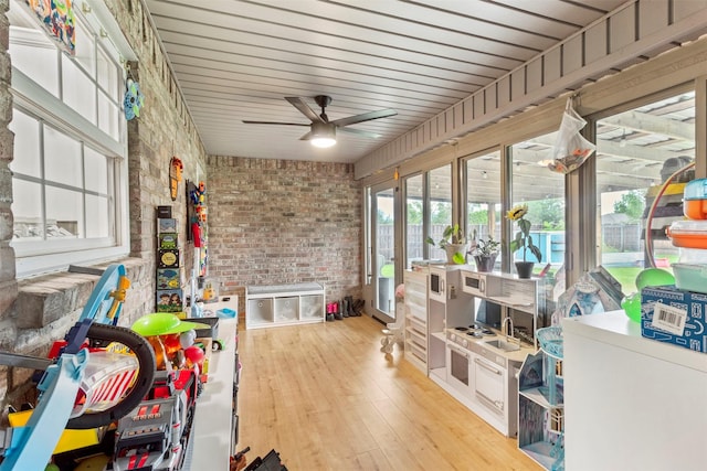 110 Harmon Cir, Blue Ridge, TX 75424 - sunroom featuring a ceiling fan, hardwood / wood-style floors, and brick wall