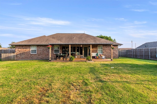 110 Harmon Cir, Blue Ridge, TX 75424 - back of property with brick siding, a patio area, and roof with shingles