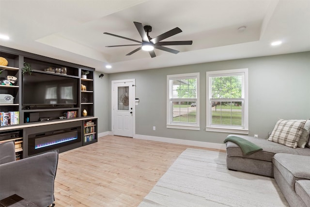 110 Harmon Cir, Blue Ridge, TX 75424 - living area with a tray ceiling, a ceiling fan, wood finished floors, baseboards, and recessed lighting