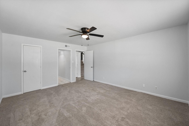 1312 E Collin, Corsicana, TX 75110 - unfurnished bedroom featuring carpet flooring, baseboards, and a ceiling fan