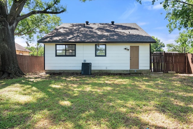 1312 E Collin, Corsicana, TX 75110 - rear view of house featuring a shingled roof and central AC
