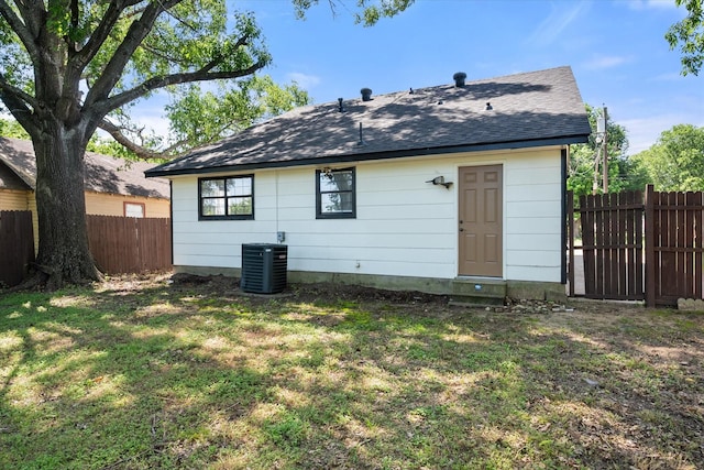 1312 E Collin, Corsicana, TX 75110 - rear view of property featuring central AC, a shingled roof, and entry steps