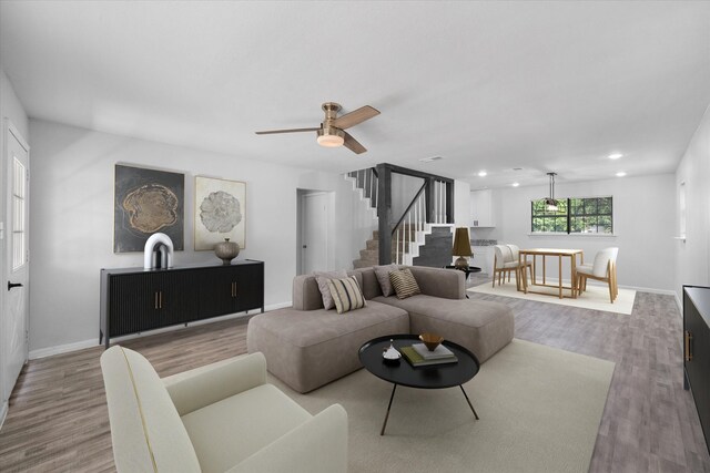1312 E Collin, Corsicana, TX 75110 - living room featuring wood finished floors, baseboards, stairs, ceiling fan, and recessed lighting