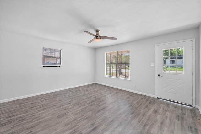1312 E Collin, Corsicana, TX 75110 - entryway with wood finished floors, ceiling fan, and baseboards