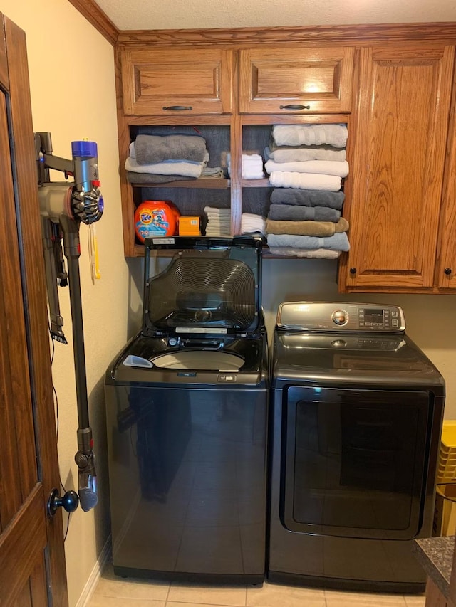 116 Summerall Dr, Mabank, TX 75156 - washroom with cabinet space, separate washer and dryer, and baseboards