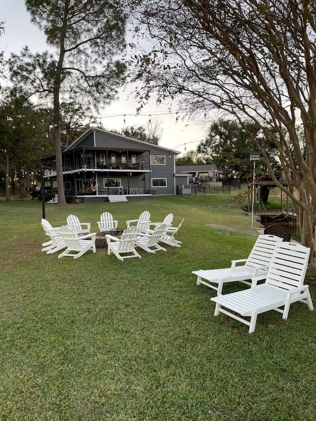 116 Summerall Dr, Mabank, TX 75156 - view of grassy yard featuring an outdoor fire pit