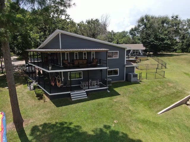 116 Summerall Dr, Mabank, TX 75156 - rear view of property with a wooden deck, a lawn, and view of wooded area