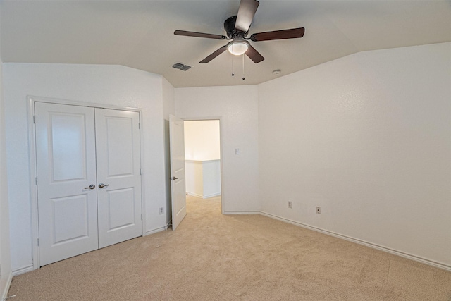 6547 Portside Ridge Ln, Dallas, TX 75249 - unfurnished bedroom featuring lofted ceiling, light colored carpet, a closet, baseboards, and a ceiling fan