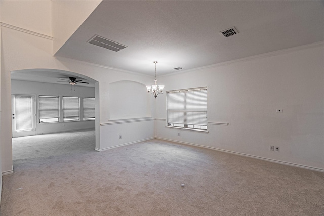 6547 Portside Ridge Ln, Dallas, TX 75249 - spare room with crown molding, light colored carpet, a chandelier, ceiling fan, and arched walkways