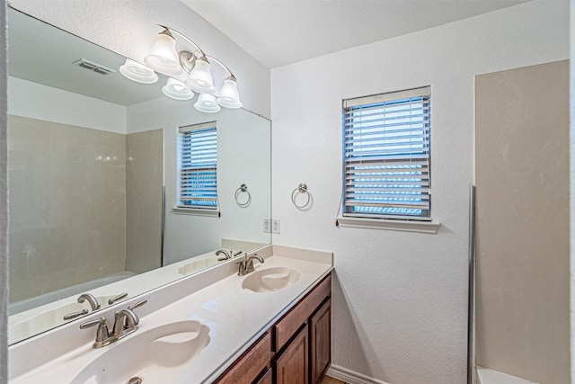 6547 Portside Ridge Ln, Dallas, TX 75249 - bathroom with double vanity and a shower