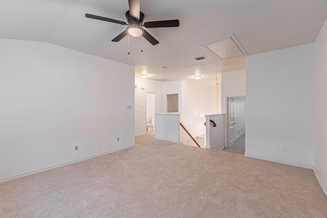 6547 Portside Ridge Ln, Dallas, TX 75249 - spare room with attic access, light carpet, ceiling fan, baseboards, and lofted ceiling
