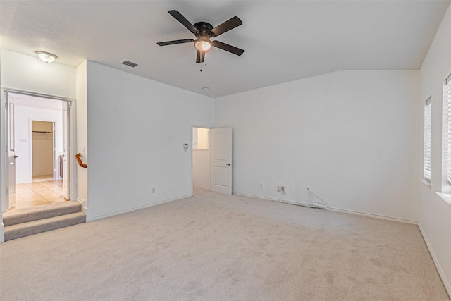 6547 Portside Ridge Ln, Dallas, TX 75249 - unfurnished bedroom featuring carpet floors, baseboards, ceiling fan, and vaulted ceiling