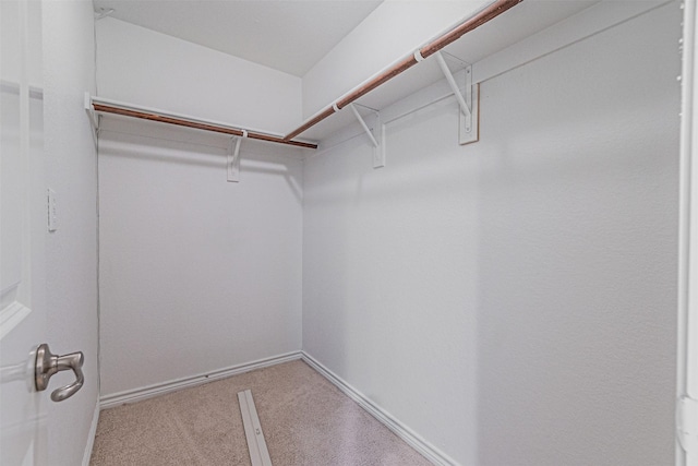 6547 Portside Ridge Ln, Dallas, TX 75249 - walk in closet featuring carpet