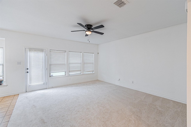 6547 Portside Ridge Ln, Dallas, TX 75249 - empty room with ceiling fan, healthy amount of natural light, light colored carpet, and baseboards