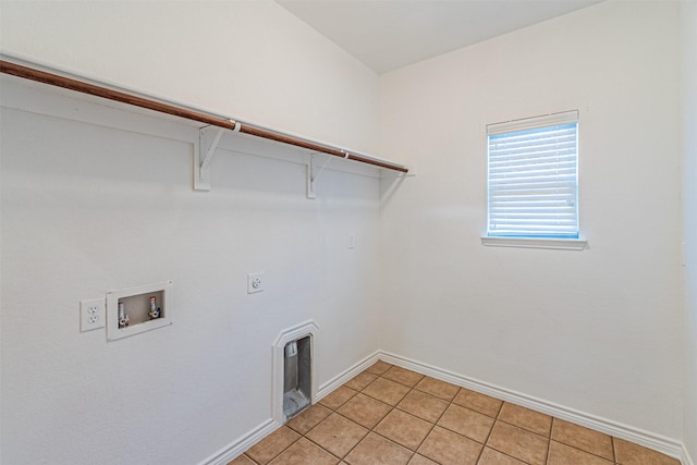 6547 Portside Ridge Ln, Dallas, TX 75249 - laundry area with washer hookup, hookup for an electric dryer, baseboards, and light tile patterned floors