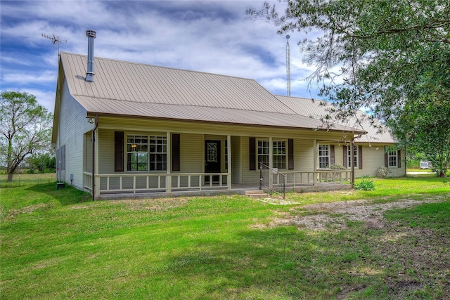 5701 Fm 2101, Quinlan, TX 75474 - view of front of property with covered porch, a front yard, and metal roof