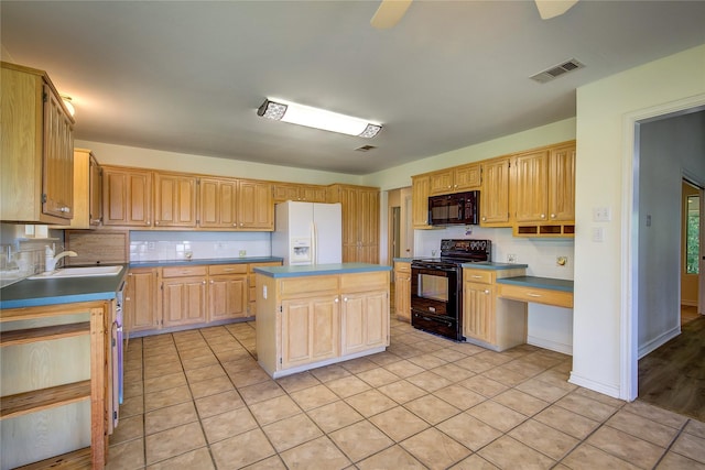 5701 Fm 2101, Quinlan, TX 75474 - kitchen with black appliances, a kitchen island, light tile patterned floors, and light brown cabinetry