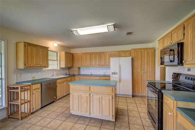 5701 Fm 2101, Quinlan, TX 75474 - kitchen featuring black appliances, a sink, a kitchen island, and light tile patterned floors