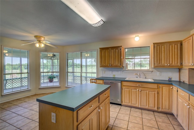 5701 Fm 2101, Quinlan, TX 75474 - kitchen with dishwasher, a sink, dark countertops, a ceiling fan, and light tile patterned floors
