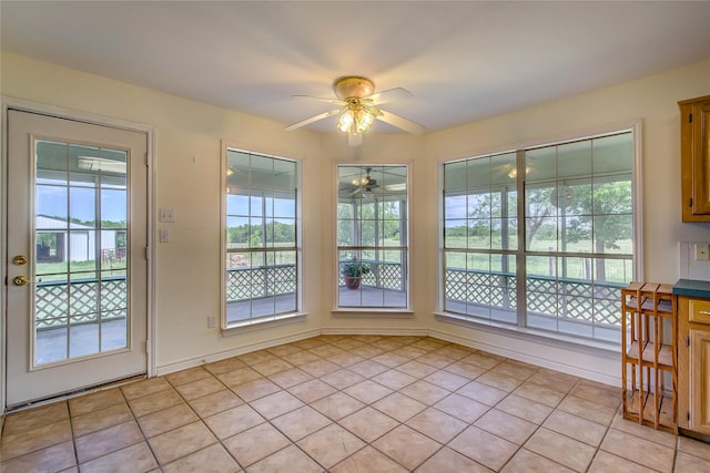 5701 Fm 2101, Quinlan, TX 75474 - unfurnished dining area featuring a ceiling fan, plenty of natural light, and light tile patterned floors