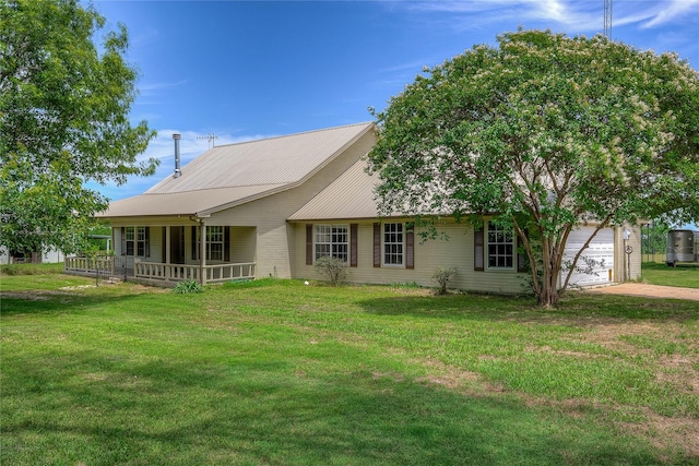 5701 Fm 2101, Quinlan, TX 75474 - view of front of home featuring a garage, a front lawn, and driveway