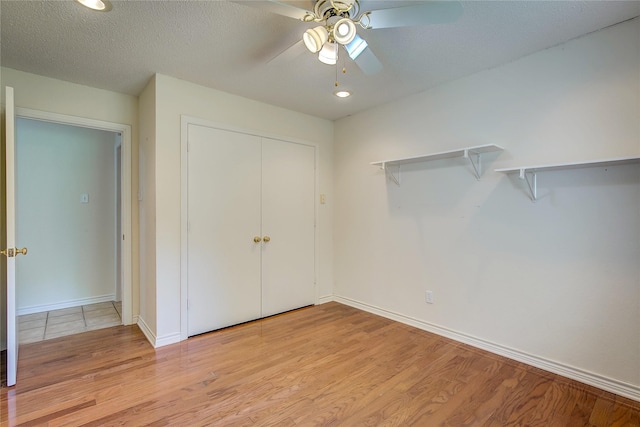 5701 Fm 2101, Quinlan, TX 75474 - unfurnished bedroom featuring light wood finished floors, baseboards, a closet, ceiling fan, and recessed lighting